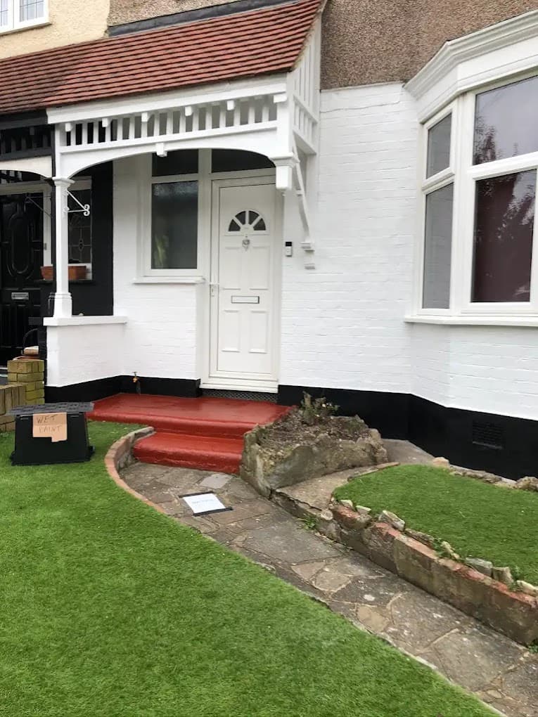 Exterior works with newly laid lawn and tidy steps